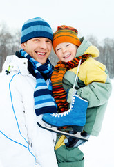 father and son go ice skating