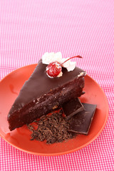 Slice of chocolate cake on the table
