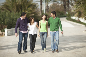 Obraz premium Four happy people walking