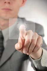 Businessman pressing virtual button