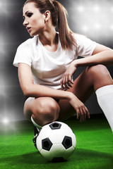 Sexy soccer player, woman on playing field