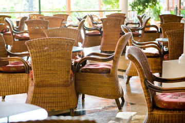 Brown wooden chairs an tables on patio