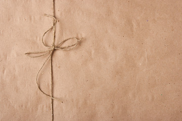 Bow from a twine on a packing paper