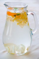 Pitcher with water and fruits
