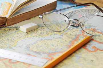 map and  glasses