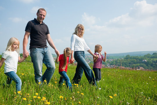 Family Having A Walk In Spring