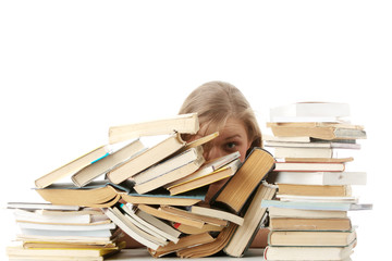 Young woman sitting behind books