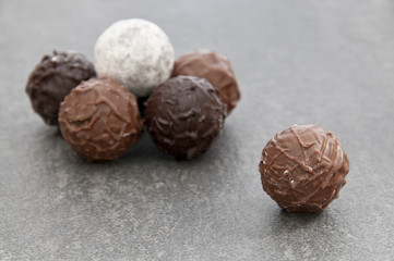 Three different chocolate truffles