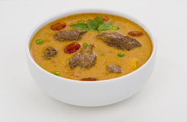 red curry in a white bowl