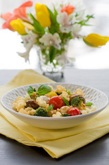 Pasta with broccoli, tomatoes and mozzarella