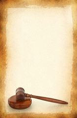 wooden gavel against old dirty background