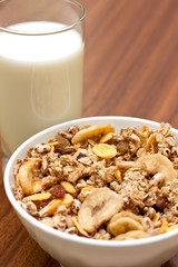 Breakfast cereals and dry fruit with glass of milk