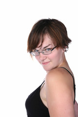 pretty, stylish young woman looking over glasses