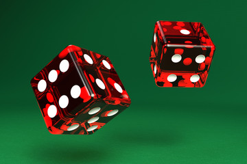 Two dice on green felt with clipping path