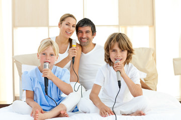 Fototapeta premium Jolly family singing together