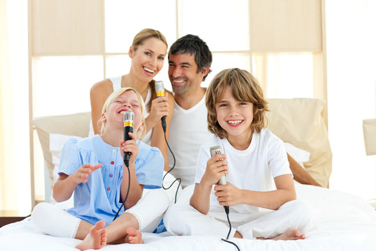 Happy family singing together