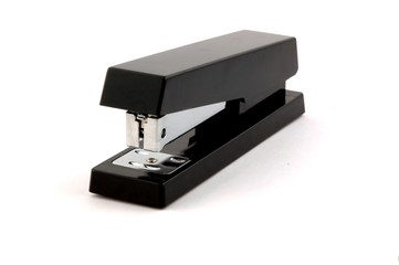 Black stapler isolated on pure white