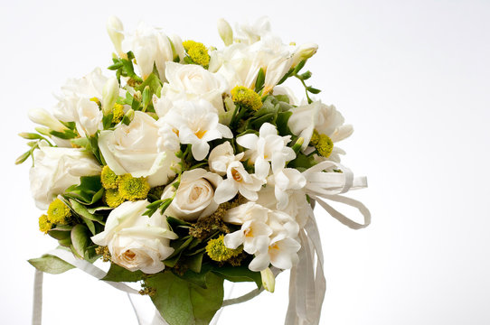 closeup of white wedding bouquet.