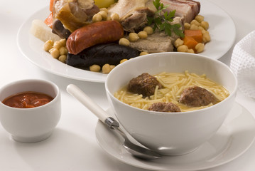 Spanish cuisine. Soup meat and vegetables in a pot Madrid style.