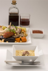 Spanish cuisine. Soup meat and vegetables in a pot Madrid style.
