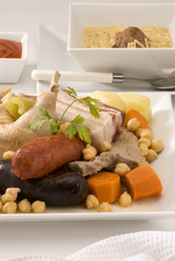 Spanish cuisine. Soup meat and vegetables in a pot Madrid style.