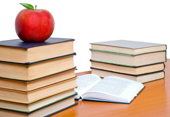 Books and apple isolated on white background