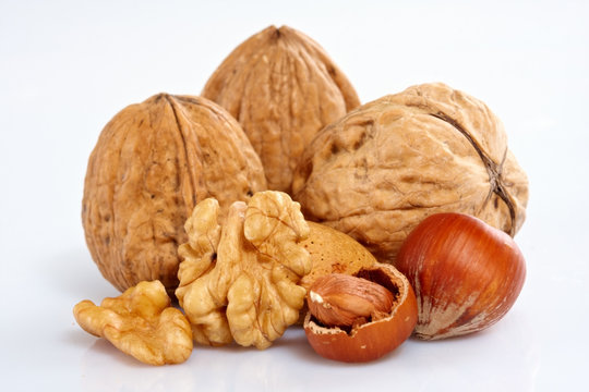 Assortment of nuts displayed on white background