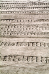 tracks of caterpillar on the sand