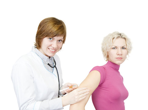 Doctor giving a girl an intramuscular injection