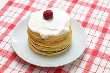 pancakes with cream and cherries