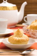 Served eclair on a plate