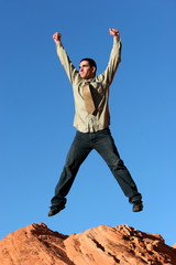 Obraz premium Happy businessman jumping