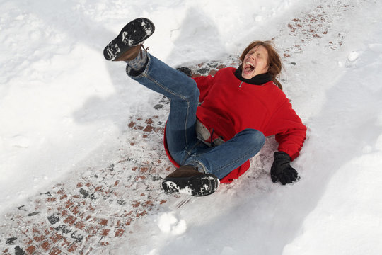 woman slipping on black ice