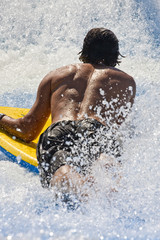 Man on Surfboard from Back