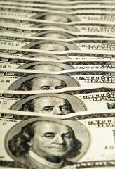 dollar banknotes row on soft focus