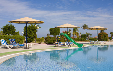 Swimming pool on a sunny day. Hurghada city in Egypt.