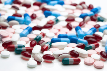 Pile of pills on a white surface