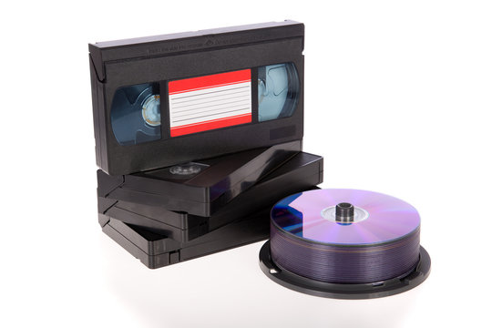 Old Video Cassette tapes with DVD discs isolated