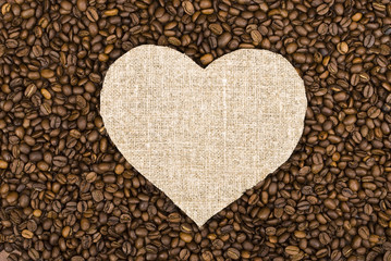 Sackcloth heart on coffee beans background