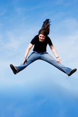 girl jumping with cloud background