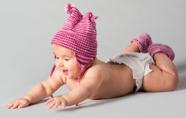 Smiling baby girl lying