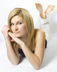 beautiful young woman lies on the ground