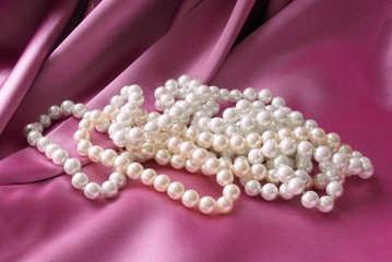 pearls on pink satin