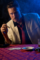 gambler with gun in smoke-filled room