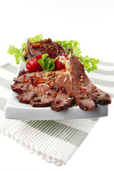beef meat slices on ceramic plate