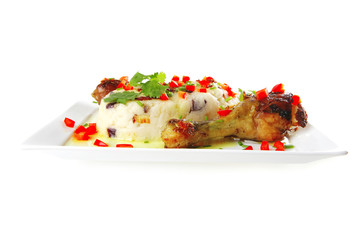 chicken legs served with vegetables