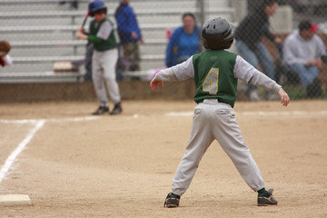Runner leading off of first base.