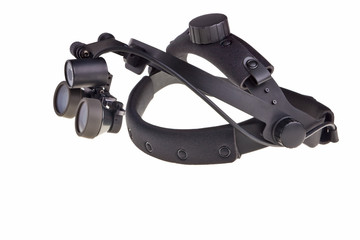 Obraz premium Dental head-mounted loupe isolated over white background.