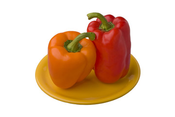 orange and red sweet pepper on yellow plate