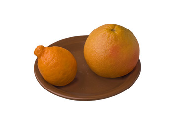 grapefruit and miniola on brown plate